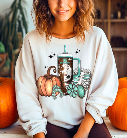 Fall Pumpkin, Cow Print Tumbler and Sneakers DTF transfer shown on a garment