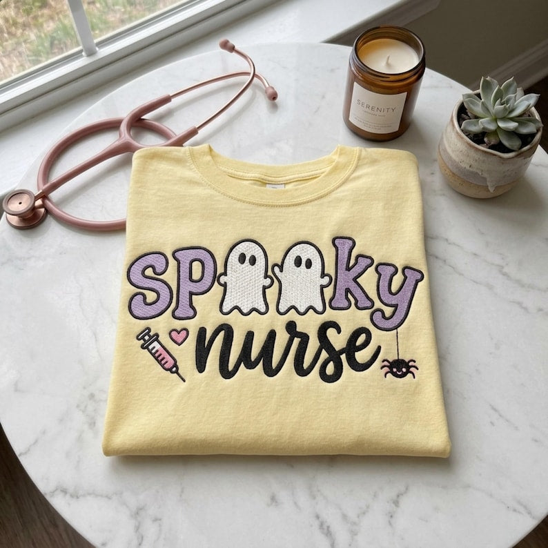 Spooky Nurse embroidery design on a finished yellow sweatshirt