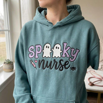 Spooky Nurse embroidery design worn on a finished teal hoodie