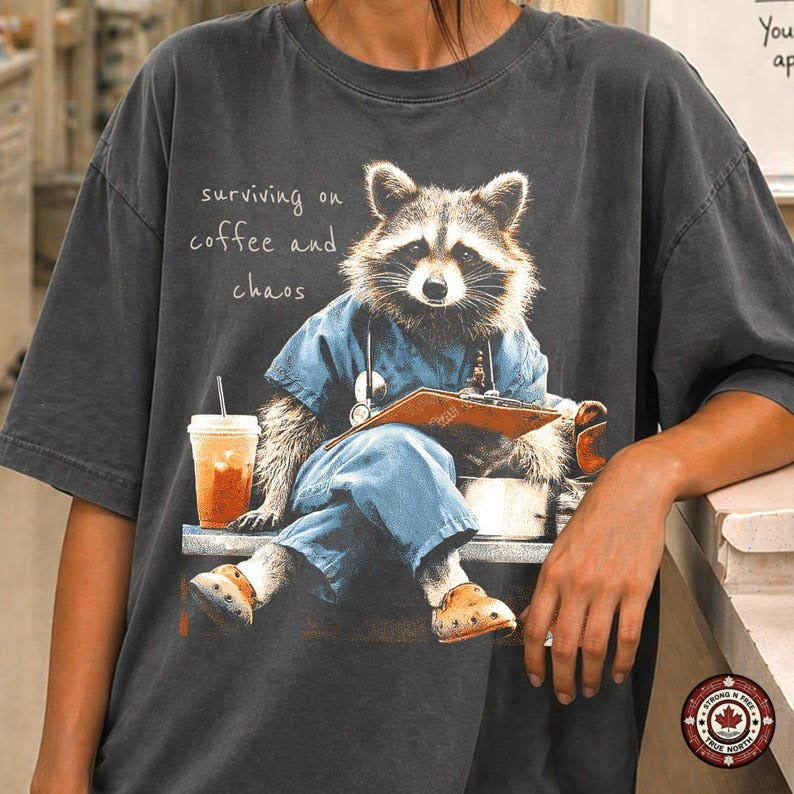 Nurse Raccoon Surviving on Coffee and Chaos DTF transfer mockup 1