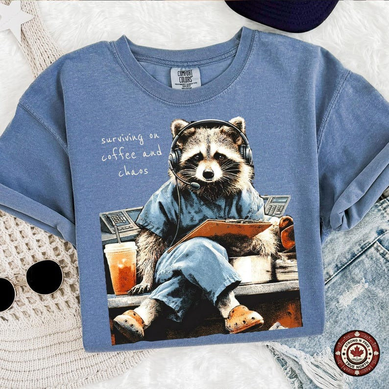Dispatcher Raccoon Surviving on Coffee and Chaos DTF transfer mockup 3