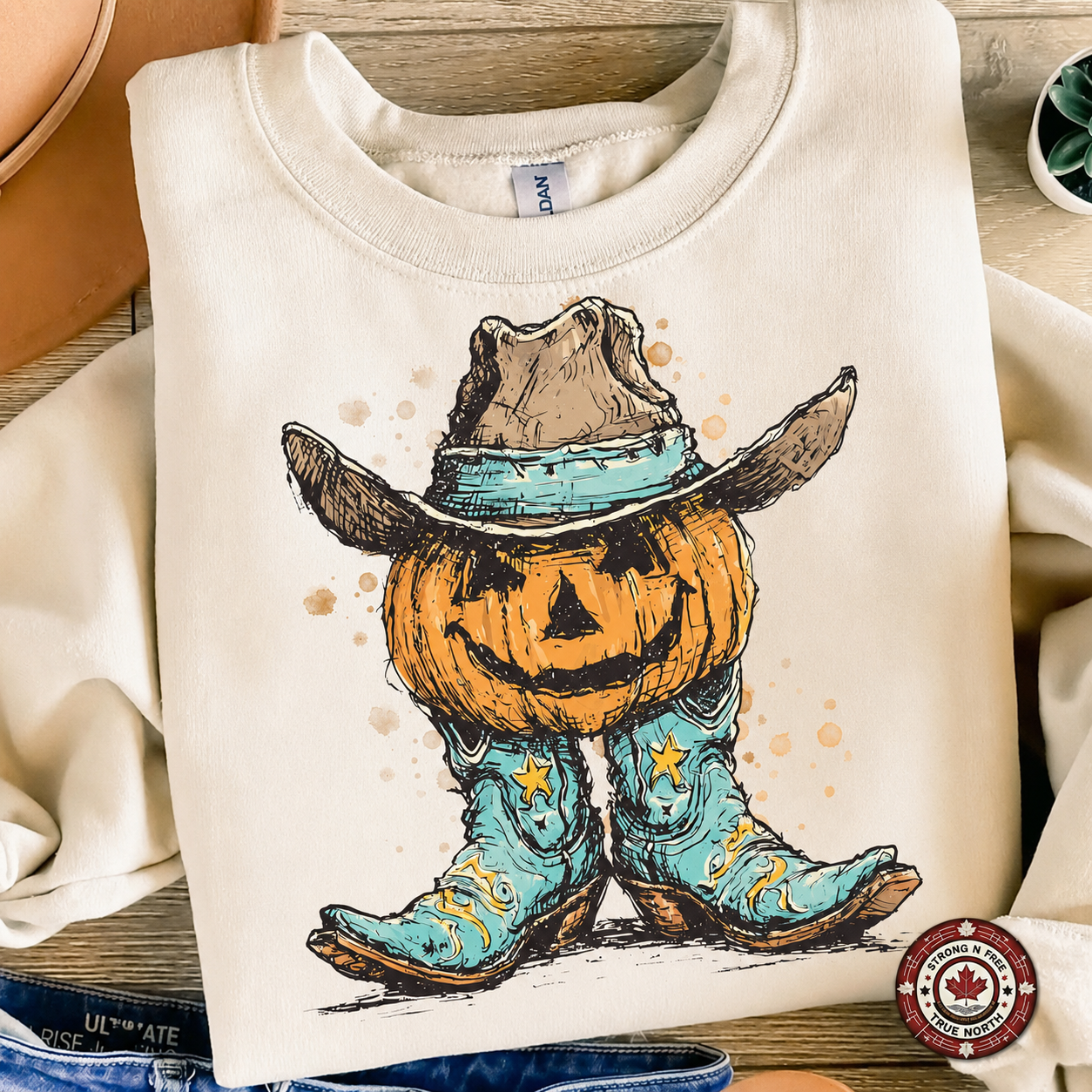 Western Pumpkin Cowboy Boots DTF transfer on a cream sweatshirt
