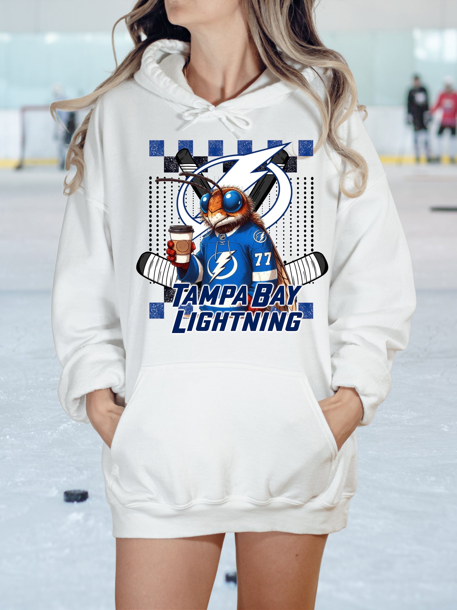 a woman wearing a white tampa lightning hoodie