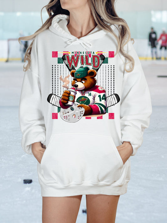 a woman wearing a white hoodie with a bear on it