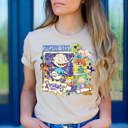 a woman wearing a t - shirt with cartoon characters on it