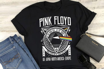 a black shirt with pink floyd on it