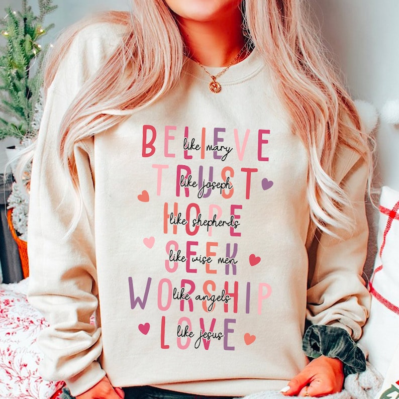 a woman wearing a sweatshirt with words on it